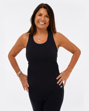 womens black gym top made from recycled plastic. sustainable activewear for women