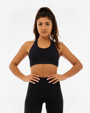 black womens sustainable gymwear. sports bra made from recycled plastic with KAMI branding on the front