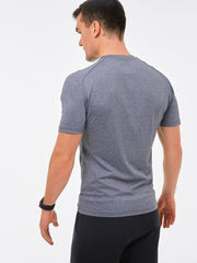back of heathered grey mens t-shirt made from recycled plastic. Sustainable gymwear for men
