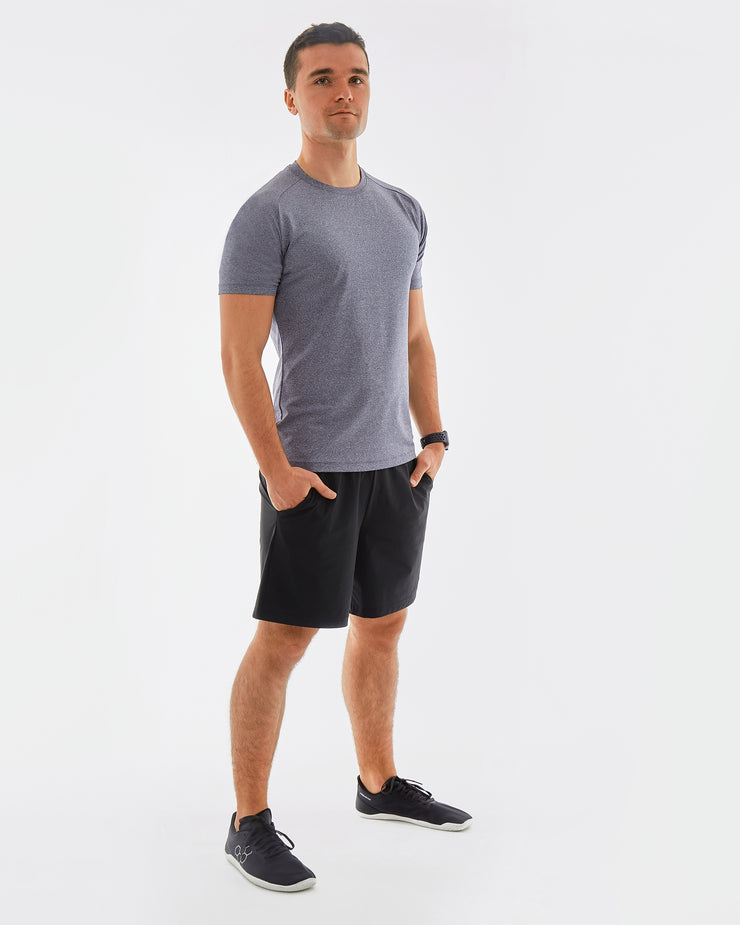 mens sustainable gymwear set. heathered grey t-shirt made from recycled plastic with 2 layer black shorts