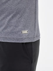 mens sustainable gym top. heathered grey fabric with metal plaque with wave logo design