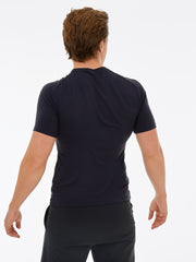 back of a man wearing a black gym top and black shorts